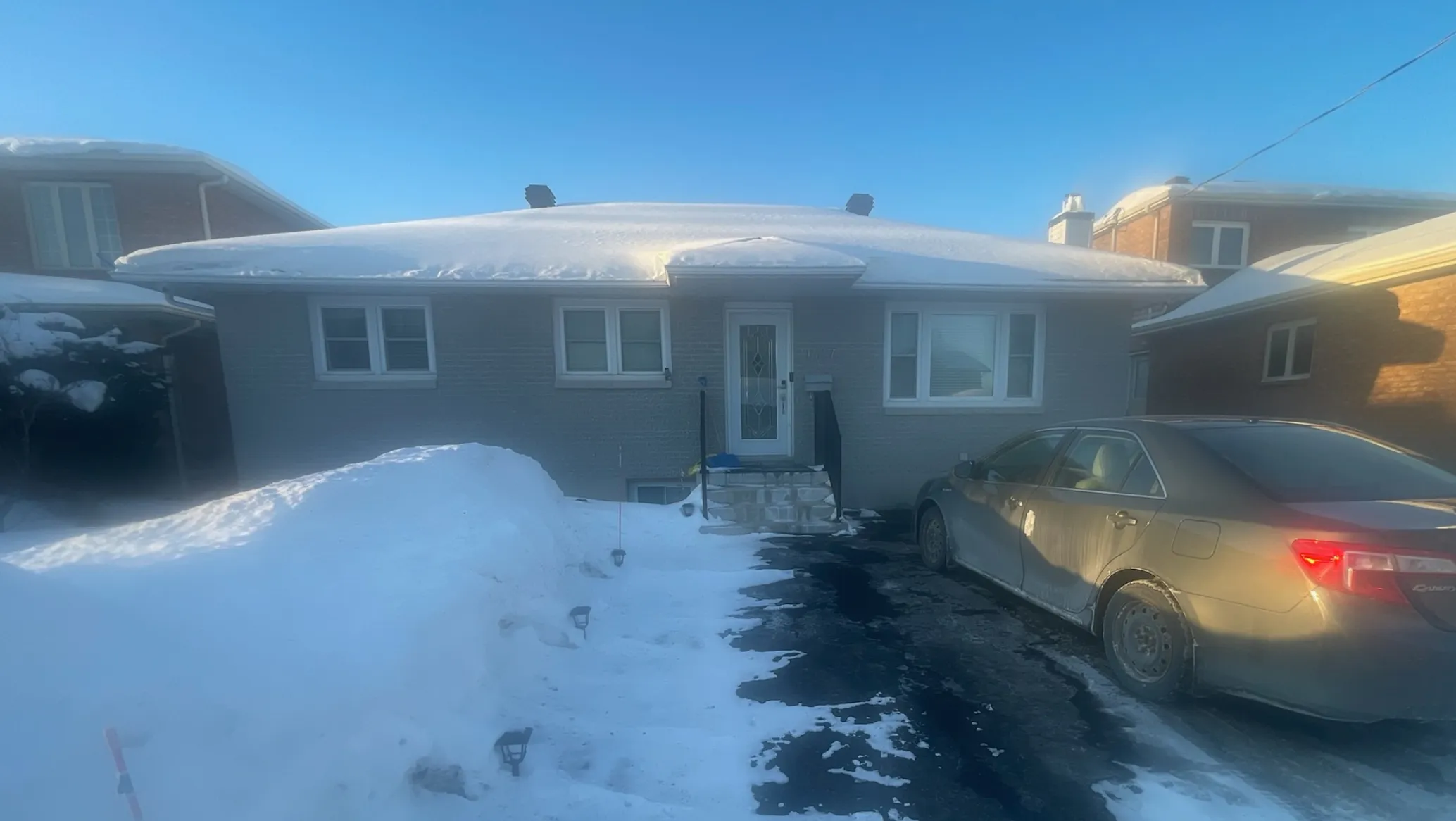 Older Edmonton-area bungalow representative of mid-twentieth-century Alberta housing supply where asbestos-containing materials (vermiculite attic insulation, pipe wrap, floor tile, popcorn ceiling) are commonly encountered during pre-sale inspection.
