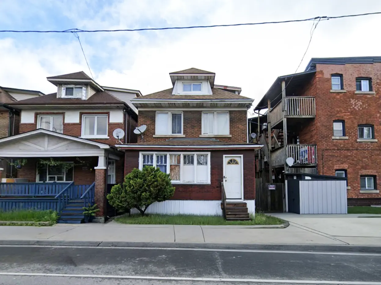 A residential Alberta detached home in a mature neighbourhood — the kind of property where vacancy or a non-tenant occupant raises the squatters-rights question owners frequently ask before selling.