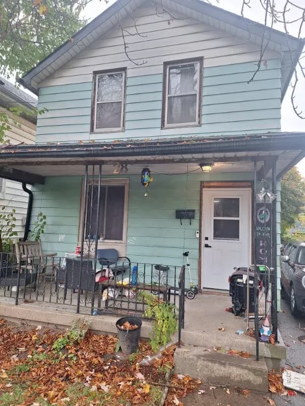 Cash home purchase, Brooks, Alberta Wood-sided two-storey home in an established Brooks, Alberta neighbourhood — recently purchased by Canadian Home Buyers and closed as-is in cash through a licensed Alberta real estate lawyer.