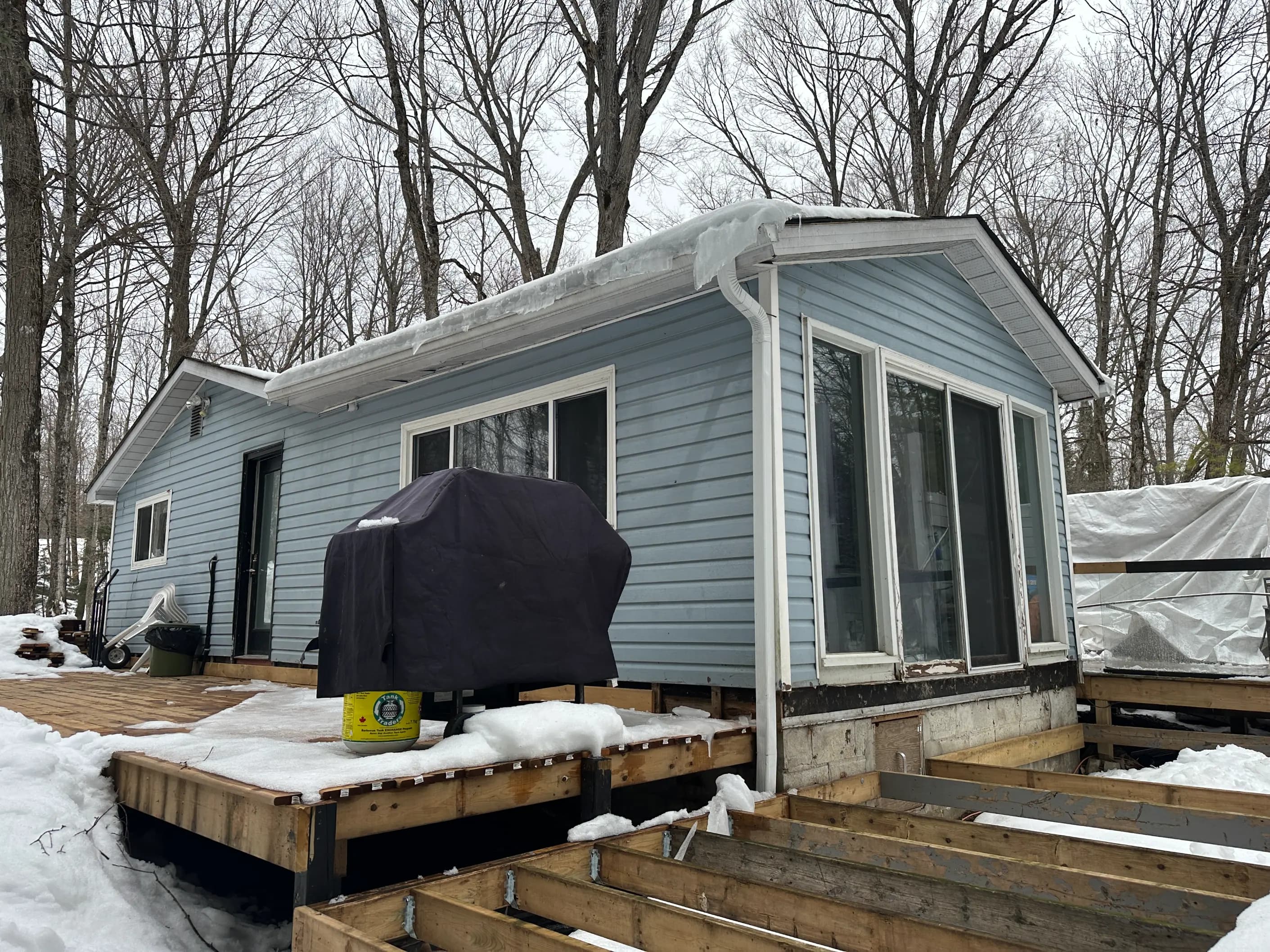 Cash home purchase, Okotoks, Alberta Small detached home on a treed lot near Okotoks, Alberta recently purchased by Canadian Home Buyers — closed as-is in cash.